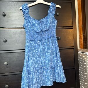 blue dress with white pattern on it. thick spaghetti strap and cinch on waist